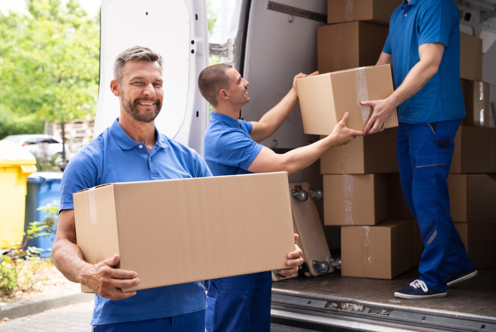 Truck,Movers,Loading,Van,Carrying,Boxes,And,Moving,House